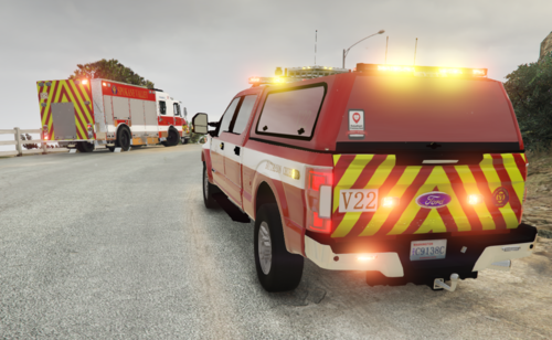 Could contain: land vehicle, outdoor, sky, wheel, transport, emergency service, firefighter, emergency vehicle, road, emergency, fire, tire, auto part, ambulance, car, fire department, van, mode of transport, fire apparatus, ground, parked, truck, yellow, vehicle