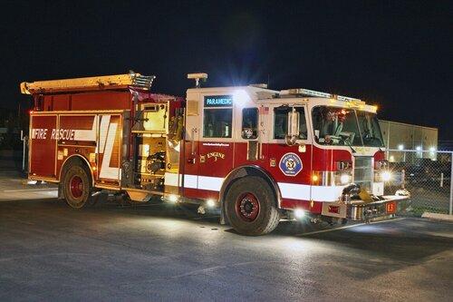 Could contain: vehicle, transport, fire, wheel, truck, land vehicle, fire department, firefighter, fire apparatus, emergency service, emergency vehicle, outdoor, emergency, auto part, road, rescue, fire station, service, department, engine, parked, red, night