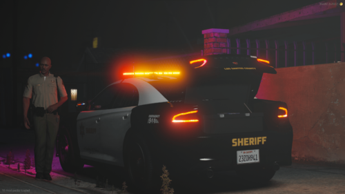 Could contain: vehicle, land vehicle, outdoor, tire, wheel, automotive lighting, automotive tail & brake light, text, auto part, automotive exterior, person, automotive design, light, ground, car, standing, street, night