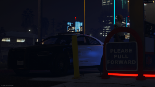 Could contain: vehicle, land vehicle, outdoor, building, text, wheel, night, street, dark, light, city, car