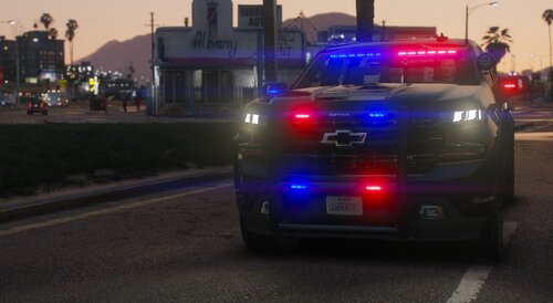 Could contain: land vehicle, vehicle, text, outdoor, wheel, road, vehicle registration plate, transport, automotive tail & brake light, automotive lighting, car, street, light, auto part, police, automotive exterior, emergency vehicle, emergency service, traffic, emergency