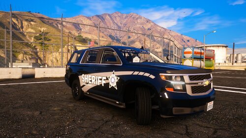 Could contain: outdoor, vehicle, land vehicle, sky, tire, wheel, ground, bumper, car, auto part, motorsport, mountain, road, parked, blue