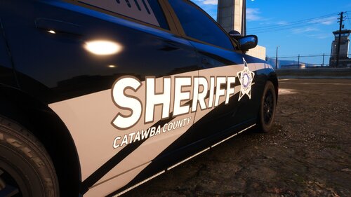 Could contain: vehicle, wheel, land vehicle, tire, outdoor, sky, text, auto part, transport, automotive tire, automotive exterior, ground, automotive wheel system, car, tread, parked