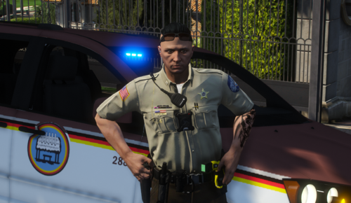 Could contain: clothing, vehicle, person, outdoor, land vehicle, law enforcement, man, car, security, police officer, officer, police