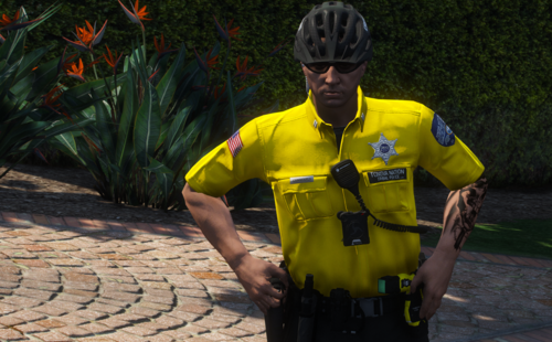 Could contain: person, outdoor, clothing, plant, yellow, helmet, bicycle helmet, personal protective equipment, wearing, ground, cycling