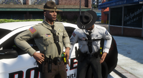 Could contain: person, clothing, outdoor, helmet, law enforcement, vehicle, police, personal protective equipment, officer, police officer, car, land vehicle, security, man