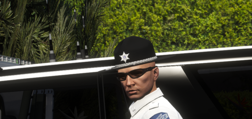 Could contain: outdoor, tree, man, person, fashion accessory, human face, clothing, sunglasses, cap, hat, wearing, uniform