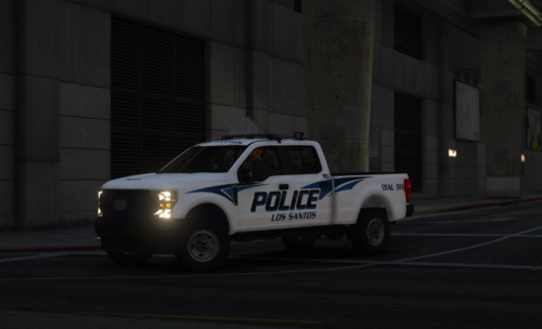 Could contain: vehicle, land vehicle, tire, wheel, road, transport, auto part, outdoor, building, automotive tire, automotive exterior, bumper, pickup truck, motor vehicle, fender, sport utility vehicle, street, car, police, truck, light