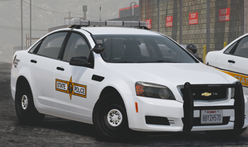 Could contain: vehicle, land vehicle, wheel, tire, text, police car, outdoor, auto part, full-size car, law enforcement, transport, vehicle registration plate, police, bumper, mid-size car, mitsubishi, ford motor company, ford, automotive light bulb, car