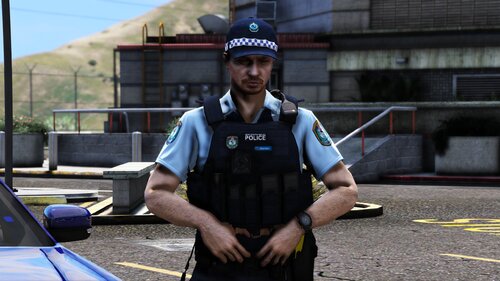 Could contain: person, clothing, outdoor, man, building, car, vehicle, officer, police, wearing