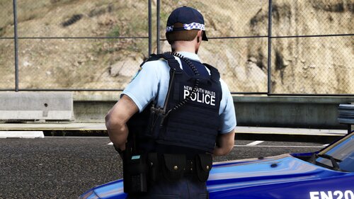 Could contain: clothing, person, outdoor, vehicle, police, land vehicle, car, law enforcement, officer