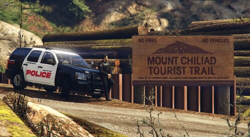 Could contain: outdoor, vehicle, text, land vehicle, wheel, transport, tire, car, grass, auto part, motor vehicle, road, van, truck, mountain, ground, parked, track, rock