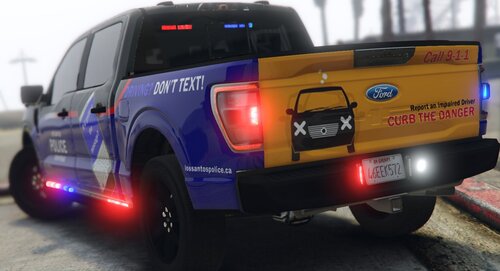 Could contain: land vehicle, wheel, text, tire, transport, car, auto part, vehicle registration plate, outdoor, automotive exterior, road, motor vehicle, bumper, automotive tail & brake light, sport utility vehicle, automotive tire, van, fender, automotive lighting, mode of transport, automotive luggage rack, parked, vehicle, street, police