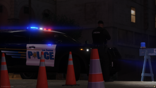 Could contain: vehicle, building, land vehicle, outdoor, car, cone, person, street, night, light