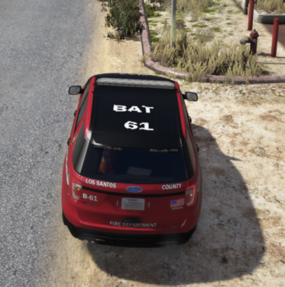 Could contain: outdoor, vehicle, land vehicle, text, ground, wheel, vehicle registration plate, car, tire, road, red, rally