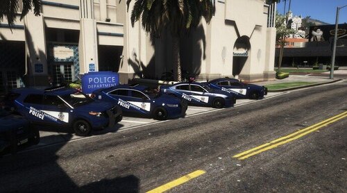 Could contain: outdoor, land vehicle, wheel, vehicle, road, tire, auto part, car, street, motorcycle, blue, parked, police