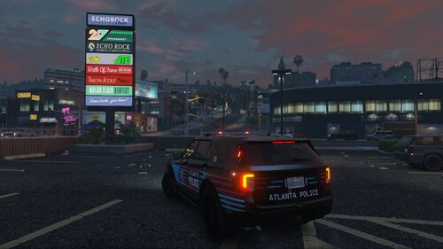 Could contain: text, vehicle, outdoor, sky, land vehicle, road, building, car, wheel, vehicle registration plate, billboard, street, automotive tail & brake light, automotive lighting, light, city, ground, night