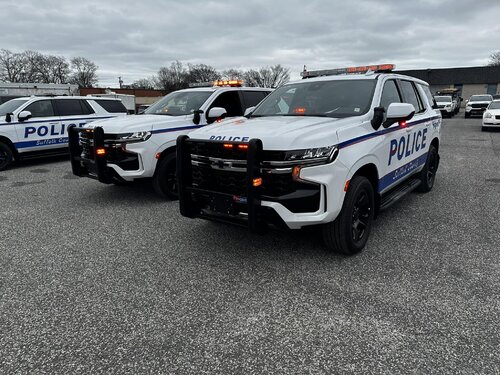 Could contain: vehicle, land vehicle, wheel, tire, outdoor, sky, bumper, auto part, text, automotive exterior, transport, automotive tire, sport utility vehicle, law enforcement, car, police car, motor vehicle, ford, automotive wheel system, automotive light bulb, emergency service, ground, police, parked