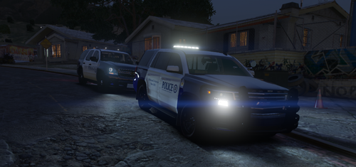 Could contain: vehicle, land vehicle, outdoor, transport, wheel, tire, vehicle registration plate, road, ground, car, police, street, van, night