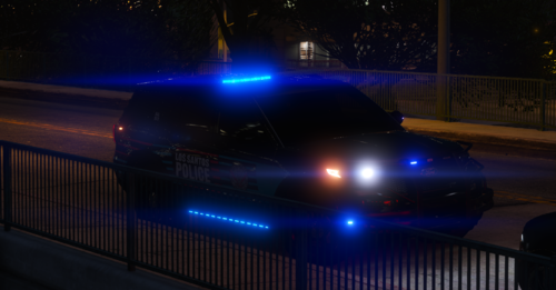 Could contain: vehicle, land vehicle, night, outdoor, car, light, automotive lighting, fence, street, driving