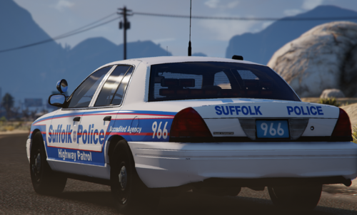 Could contain: vehicle, land vehicle, outdoor, text, wheel, transport, sky, police car, full-size car, car, road, motorsport, ford crown victoria police interceptor, tire, police, blue, rally