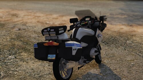 Could contain: outdoor, ground, tire, motorcycle, wheel, vehicle, land vehicle, auto part, parked, road, grass, motorbike, bag