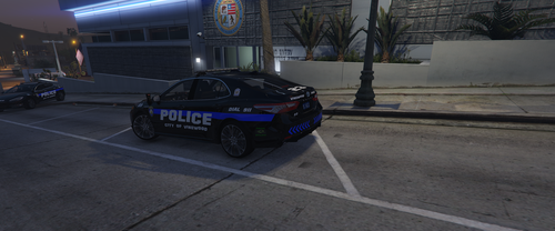 Could contain: vehicle, land vehicle, wheel, road, outdoor, tire, building, text, auto part, vehicle registration plate, sports sedan, mid-size car, car, street, blue, ground