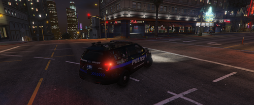 Could contain: vehicle, land vehicle, road, outdoor, building, street, wheel, car, light, city, transport, night, intersection