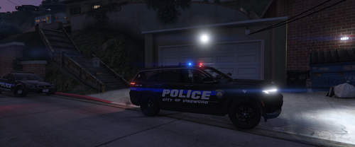 Could contain: vehicle, land vehicle, wheel, tire, outdoor, auto part, building, transport, road, car, street, police, ground