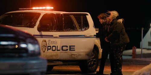 Could contain: vehicle, land vehicle, wheel, outdoor, tire, car, transport, text, van, vehicle registration plate, auto part, clothing, minivan, person, night, street, standing, police