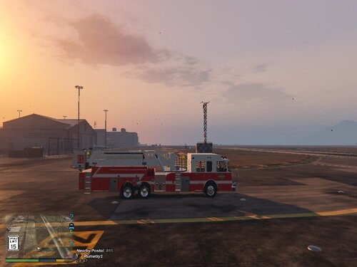 Could contain: sky, vehicle, outdoor, cloud, transport, land vehicle, wheel, truck, firefighter, fire, parked, ground, sunset