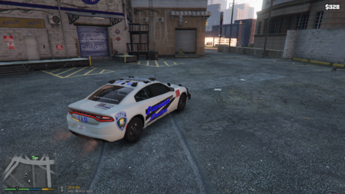 Could contain: vehicle, land vehicle, wheel, tire, transport, building, text, ground, outdoor, road, police car, car, street, police