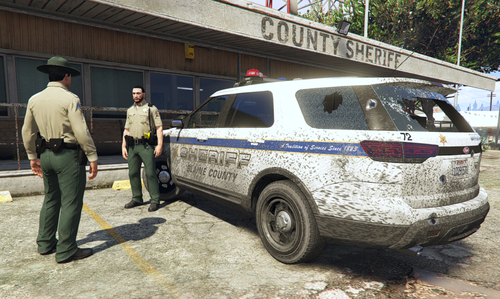 Could contain: vehicle, land vehicle, outdoor, wheel, tire, clothing, building, man, person, law enforcement, car, footwear, auto part, transport, ford, sport utility vehicle, ground, parked, police