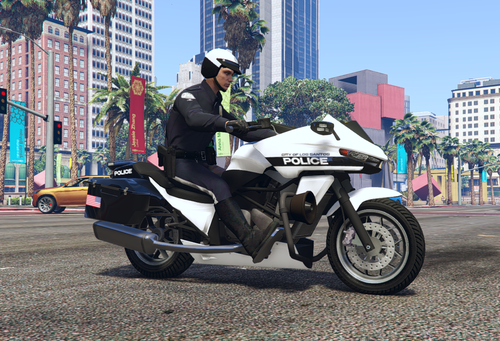 Could contain: outdoor, vehicle, wheel, land vehicle, tire, clothing, road, person, building, sky, man, auto part, motorcycle, motorcycle helmet, motorcycling, transport, motorbike, riding, ground, street, helmet, officer, police