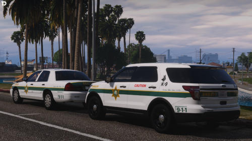 Could contain: vehicle, land vehicle, outdoor, wheel, transport, sky, tree, emergency vehicle, emergency service, police car, law enforcement, emergency, police, text, road, vehicle registration plate, police van, van, car, parked, street, ambulance