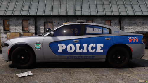 Could contain: vehicle, land vehicle, wheel, transport, tire, text, police car, auto part, car, outdoor, police, blue, parked