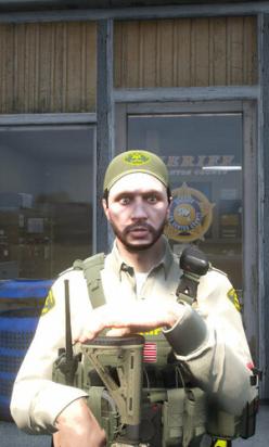 Could contain: person, human face, man, building, clothing, personal protective equipment, helmet, smile, outdoor, wearing, military uniform