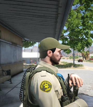 Could contain: clothing, person, outdoor, military uniform, man, human face, tree, security, military person, military organization, ground