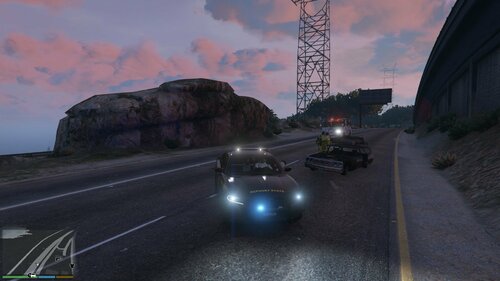 Could contain: outdoor, sky, cloud, road, land vehicle, vehicle, wheel, highway, road surface, car, driving, street, landscape, mountain