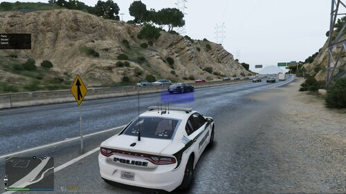 Could contain: vehicle, land vehicle, outdoor, road, wheel, transport, text, vehicle registration plate, street, driving, car, highway, traveling, police