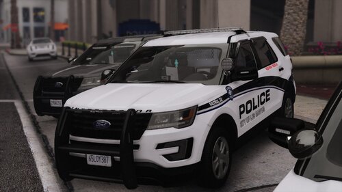 Could contain: land vehicle, vehicle, wheel, tire, police, bumper, auto part, transport, text, outdoor, ford, motor vehicle, automotive exterior, sport utility vehicle, police car, law enforcement, mitsubishi, road, vehicle registration plate, fender, car, parked, white, street