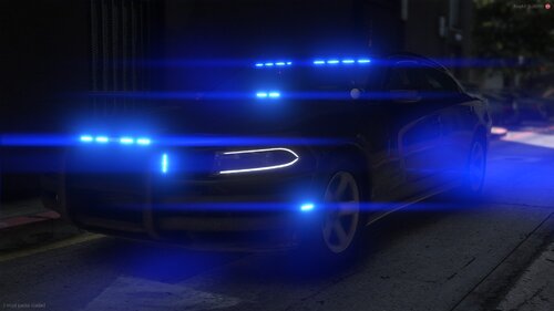 Could contain: vehicle, light, land vehicle, road, outdoor, automotive lighting, car, majorelle blue, electric blue, auto part, night, street, blue, ground