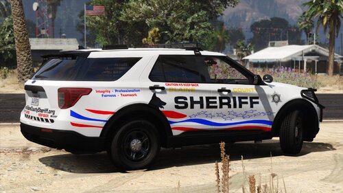 Could contain: vehicle, land vehicle, outdoor, wheel, tire, text, transport, tree, police car, car, law enforcement, auto part, ford, sport utility vehicle, automotive exterior, police, bumper, parked, ground