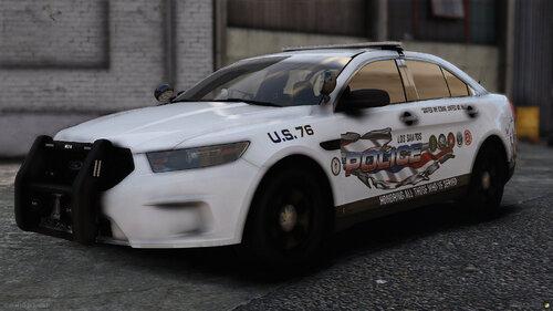 Could contain: land vehicle, vehicle, wheel, tire, auto part, full-size car, car, mid-size car, police car, outdoor, automotive light bulb, text, law enforcement, police, sports sedan, road, bumper, street