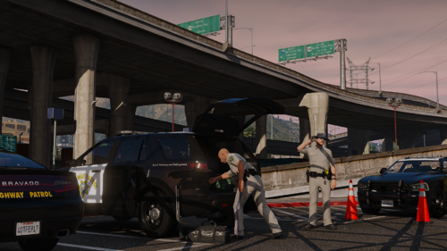 Could contain: outdoor, vehicle, land vehicle, sky, text, wheel, tire, auto part, person, billboard, building, vehicle registration plate, road, bridge, gate, track, ground, tollbooth, street, car