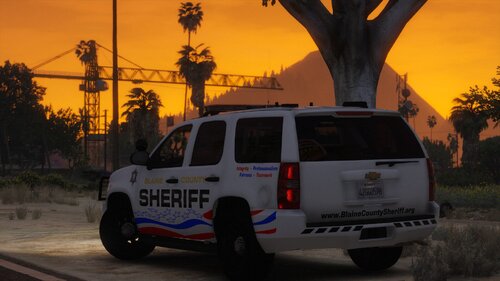 Could contain: vehicle, land vehicle, outdoor, transport, wheel, sky, tree, tire, text, sport utility vehicle, auto part, automotive luggage rack, roof rack, vehicle registration plate, sunset, minivan, automotive exterior, road, car, van, street, driving, parked, police