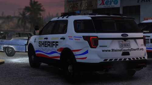 Could contain: vehicle, land vehicle, text, wheel, tire, transport, outdoor, auto part, automotive exterior, police car, sport utility vehicle, vehicle registration plate, bumper, law enforcement, ford, motor vehicle, emergency vehicle, automotive tire, car, roof rack, police, emergency service, automotive luggage rack, van, parked, street