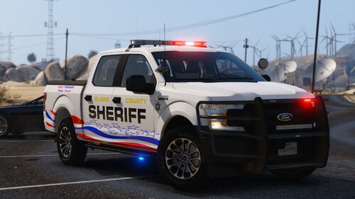 Could contain: vehicle, land vehicle, wheel, tire, transport, outdoor, text, auto part, road, law enforcement, sport utility vehicle, bumper, police car, emergency service, emergency vehicle, automotive exterior, ford, motor vehicle, automotive tire, vehicle registration plate, car, emergency, roof rack, automotive luggage rack, compact sport utility vehicle, mitsubishi, police, street, driving, truck