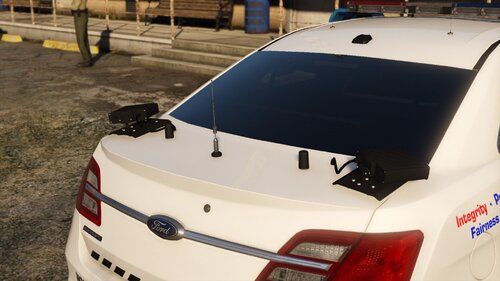 Could contain: vehicle, land vehicle, text, tire, wheel, vehicle registration plate, automotive tail & brake light, outdoor, automotive exterior, auto part, trunk, bumper, subaru, full-size car, automotive lighting, mid-size car, automotive light bulb, sports sedan, mitsubishi, automotive side marker light, automotive design, police car, car, parked, ground, police