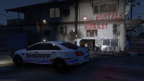 Could contain: text, land vehicle, vehicle, wheel, building, outdoor, tire, transport, vehicle registration plate, mid-size car, full-size car, police car, car, auto part, police, street, parked, light